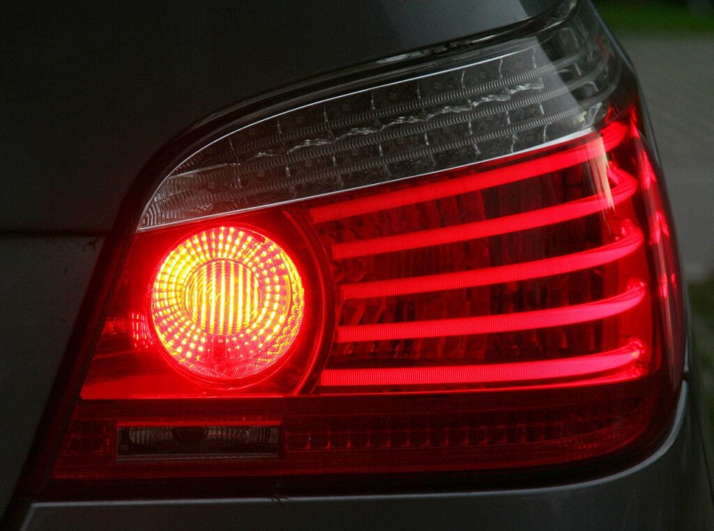 Closeup of a brake light with driver practicing braking techniques.